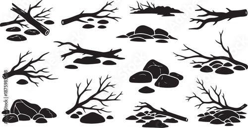 Black silhouettes of rocks and bare tree branches isolated