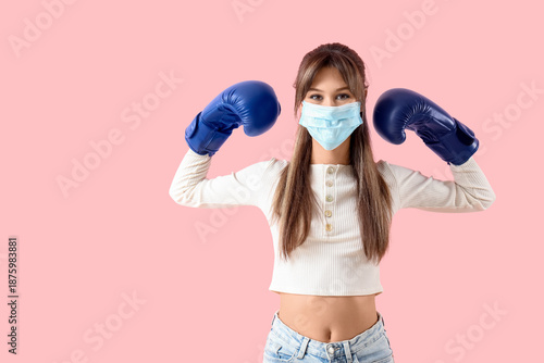 Young woman in medical mask...