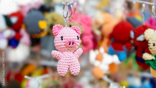 Pink pig keychain hanging on the display. DIY keychain. Back to school stuff.