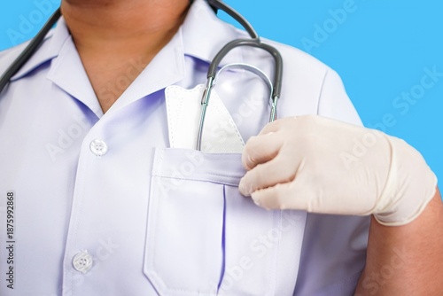 Medical Staff Storing Stethoscope and Face Mask in Upper Uniform Pocket