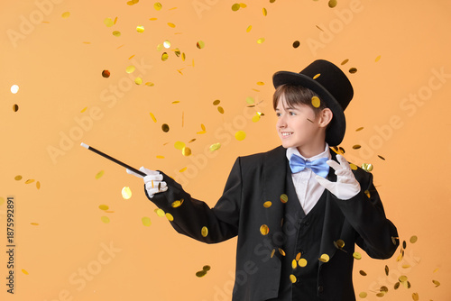 Little magician with falling confetti on beige background