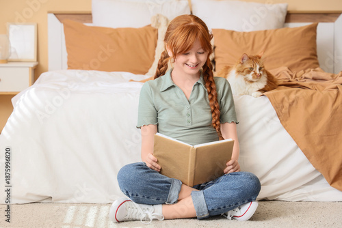 Teenage redhead girl with c...