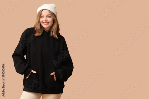 Young woman in black hoodie...