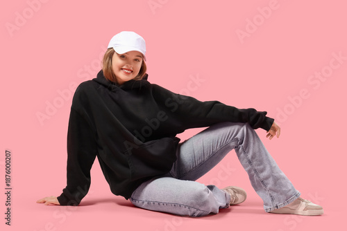 Young woman in black hoodie...