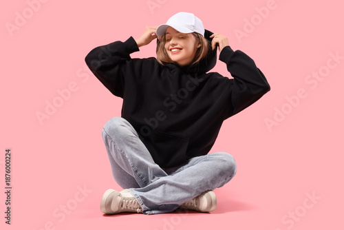 Young woman in black hoodie...