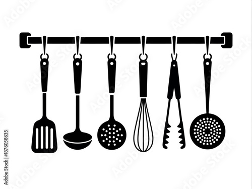 Set of metal kitchen utensils on white background including spoons spatula ladle and fork