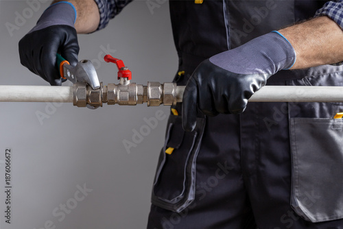  Plumber repairing water system, plumbing repair service.