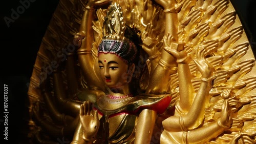 Golden Thousand-Armed Guanyin Bodhisattva Statue in Buddhist Temple