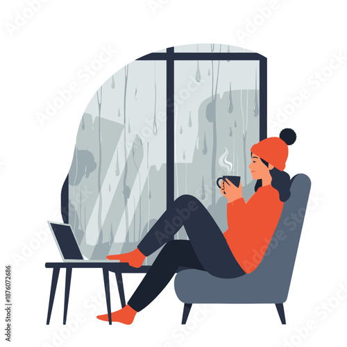 Woman drinking coffee by rainy window with laptop, cozy home scene