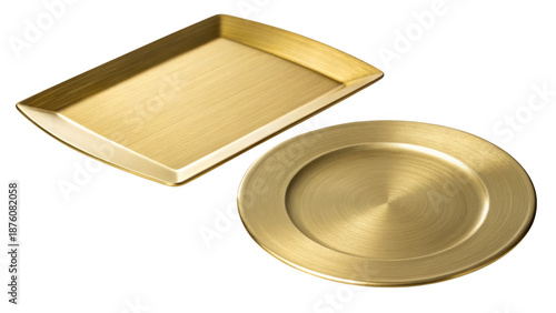 Golden metal tray and plate on black background