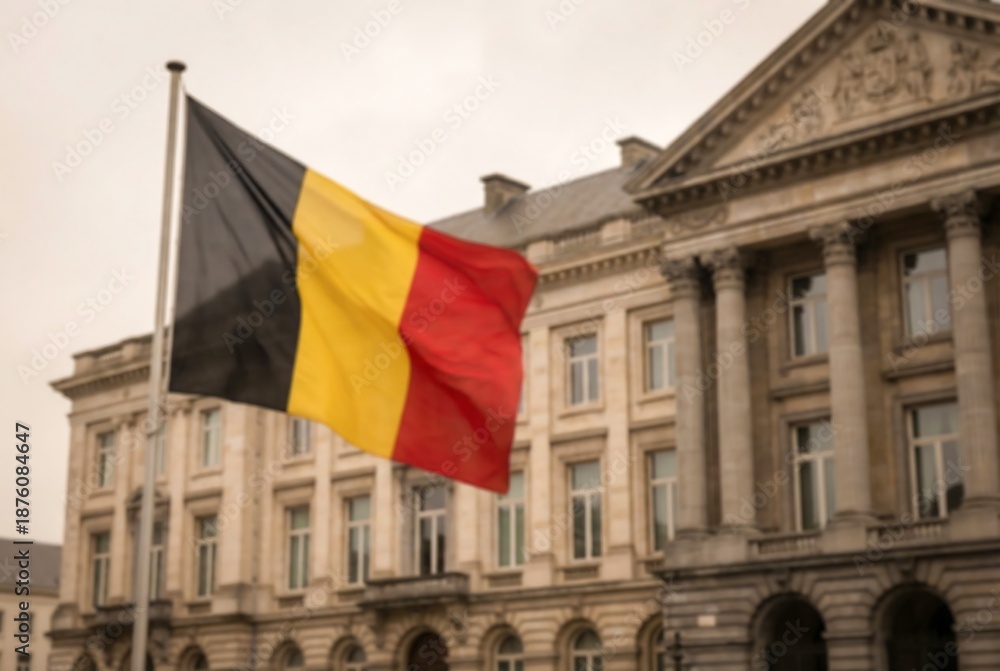 Obraz premium Belgium flag waving in front of a majestic neoclassical building. National symbol and government architecture for official use. European pride.