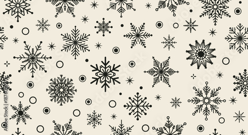Decorative seamless pattern featuring various black snowflake designs on a light cream background for winter and holiday festive themes.