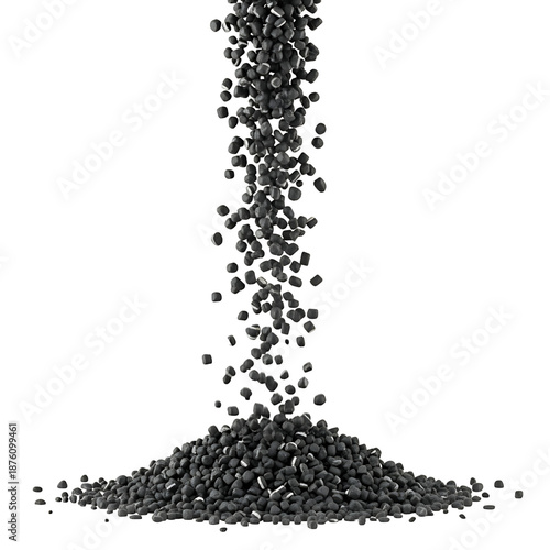 Stream of black activated carbon granules falling into a pile.