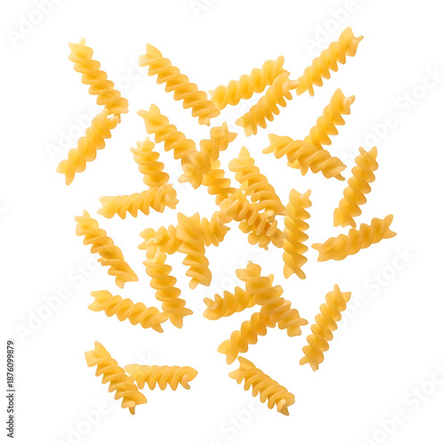 A collection of uncooked yellow fusilli pasta pieces scattered randomly.