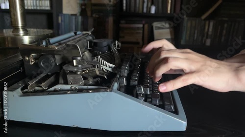 Writing a book and typing old typewriter, side view. Human hands are typing on old vintage retro typewriter. News, media or communication concept
