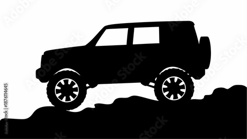 Black SUV driving on rugged terrain in silhouette