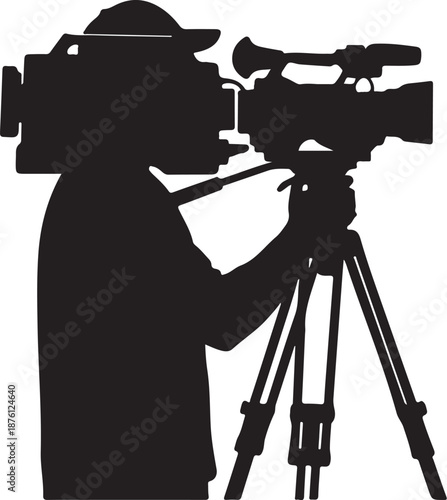 Silhouette of a Cameraman Filming with Professional Equipment Outdoors