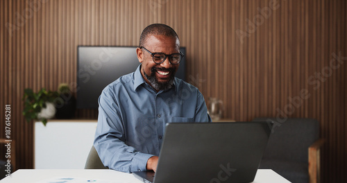 Foto Laptop, lawyer and happy black man in office for research, proposal and success for case study