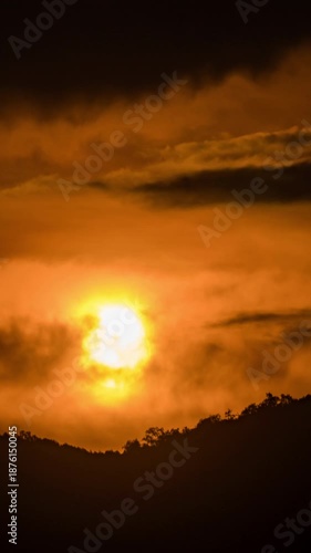 Beautiful sunrise time-lapse over the mountains with soft morning light and moving clouds.