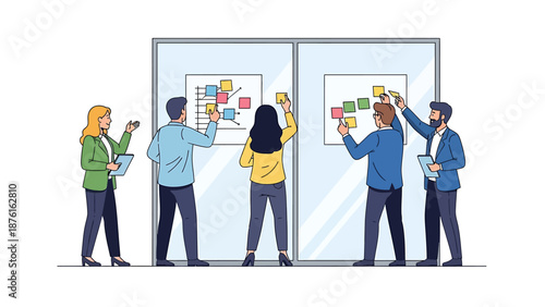 Business team collaborating on a project, placing colorful sticky notes on glass boards during a brainstorming session.
