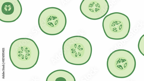 Scattered light green cucumber slices with visible seeds against a white background