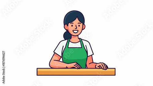 Smiling woman in green apron behind a counter