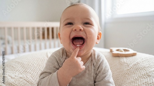Adorable baby smiling with new tooth emerging
