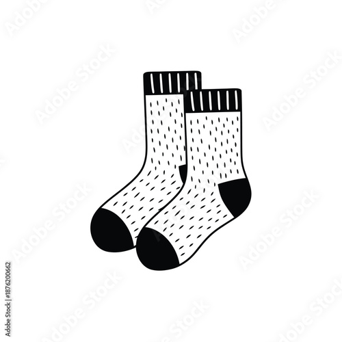 a pair of white socks with black dots and stripes
