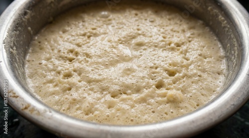 Fermented Dosa Batter Bubbling in Metal Bowl