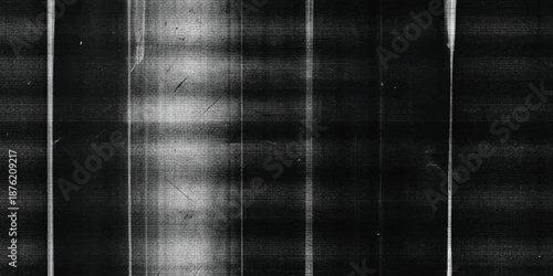 A black and white background texture featuring vintage film static and vertical distortion lines