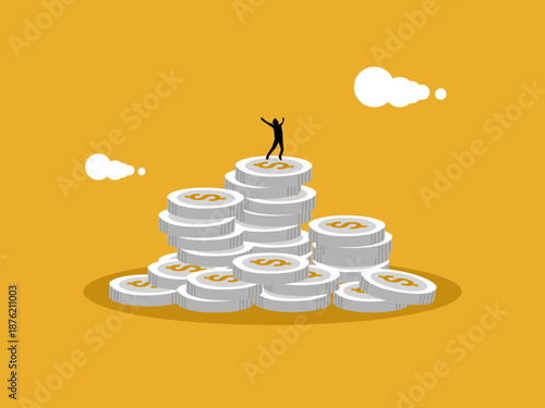 businessman jumps for joy on top of the coin