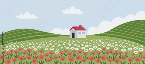 Idyllic Landscape with a House and Flower Meadow. Blooming Flowers on Spring Hill. 