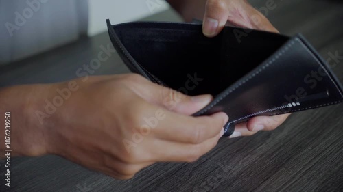 Hands Shaking Empty Wallet Showing Lack of Money
