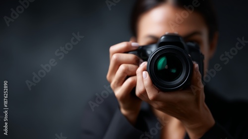 portrait of a photographer holding his camera
