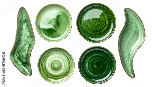 Six ceramic dishes of various greens and shapes, viewed from above, on black background