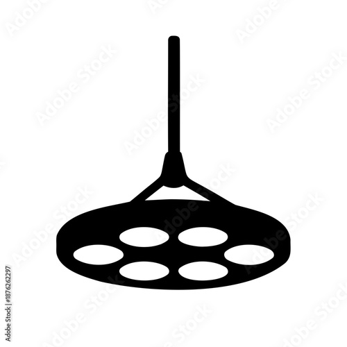 Black and white image of a surgical lamp or operating room light