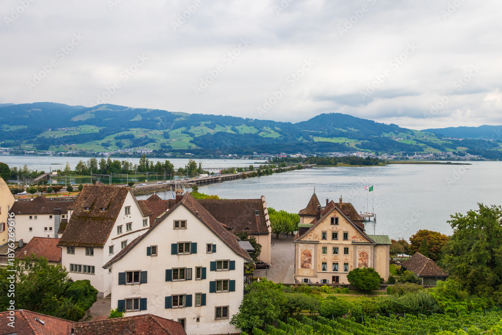 Fototapeta premium View of the old town, the Lake Zurich and mountains from the walls of Rapperswil Castle in Rapperswil-Jona, Switzerland