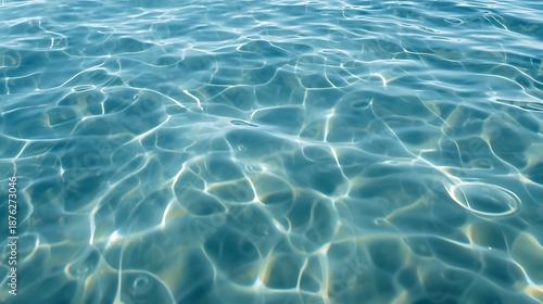 Calm ocean water with sunlight reflections on surface