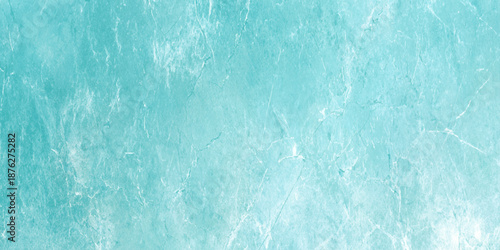 a close up of a light blue surface with white streaks and spots on it looking like a textured wall or floor