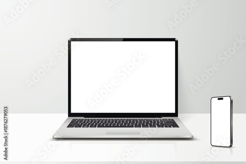Laptop and smartphone with blank screen on table realistic mockup