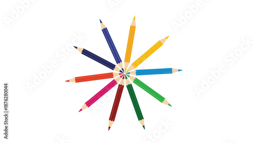 Colorful wooden colored pencils are arranged in a circular, starburst pattern with their tips pointing toward the center on a white background.