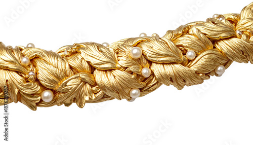 Close-up of a braided gold necklace with leaf details and pearls