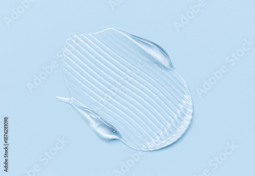 cosmetic texture gel essence smear on a blue background