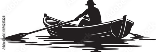 Man in a boat on the water with oar