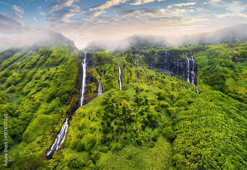 Azores - Drone view of Waterfalls with lake Poco Ribeira do Ferreiro in green landscape, Poco da Alagoinha, Fajazinha, Flores Island, Portugal, Europe