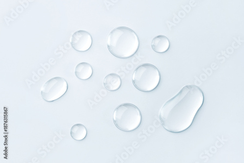 Εκτύπωση καμβά Transparent drops of cosmetics on a gray background