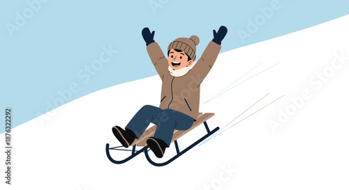 Young boy in warm winter clothes and a brown hat sleds down a snowy slope with his arms raised in pure excitement.