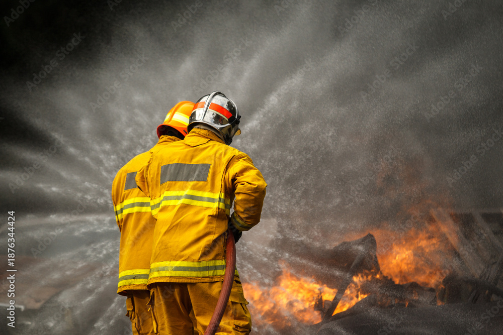 Fototapeta premium Firefighters extinguishing burning car during emergency response