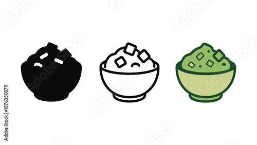 Three bowls of different colored rice on a plain background