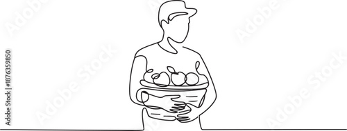 Continuous one line drawing young male farmer carrying a basket full of fruit with his hands in front of his chest. Farming minimalist concept. one line Icon drawing